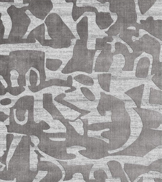 Patterned rug with abstract design in gray tones background