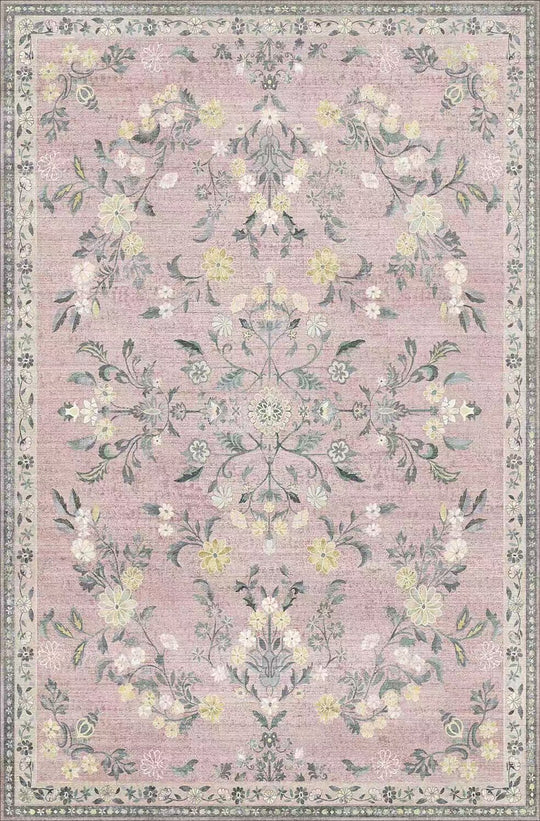 Floral patterned rug with a pink background