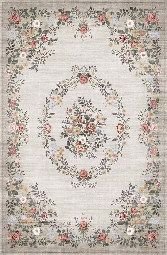 Floral patterned rug with a decorative border on a light background