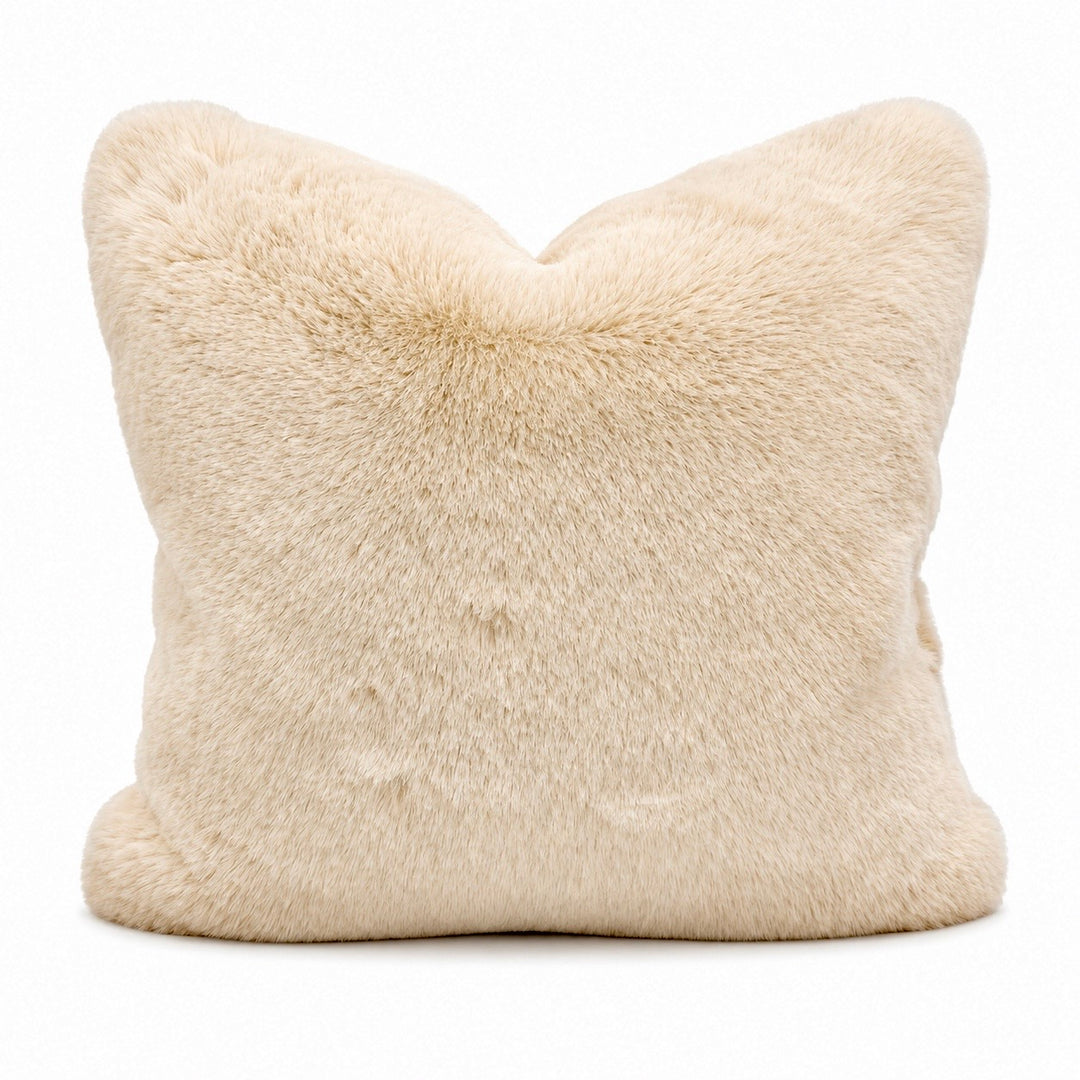 Beige fur pillow on a white background