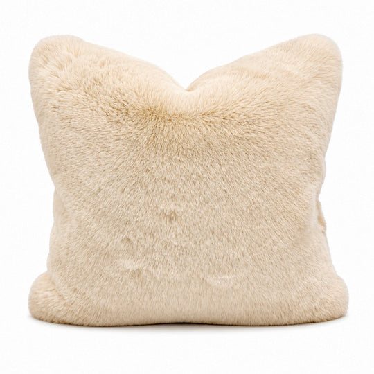 Beige fur pillow on a white background