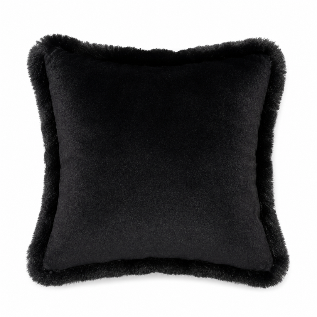 Jet Black pillow with fur trim on a white background