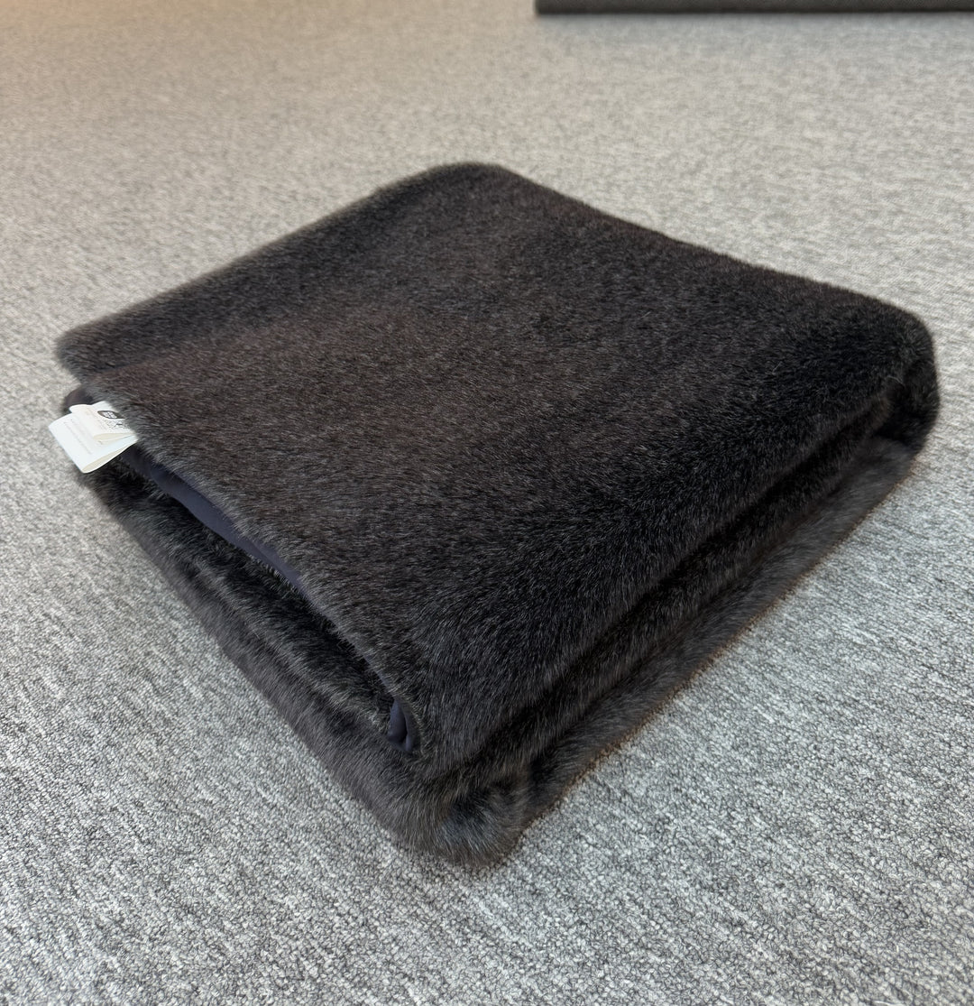 Folded dark black blanket 
