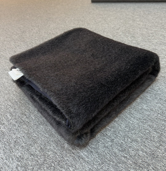 Folded dark black blanket 