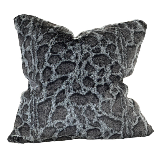 Decorative pillow with a gray and black pattern on a white background