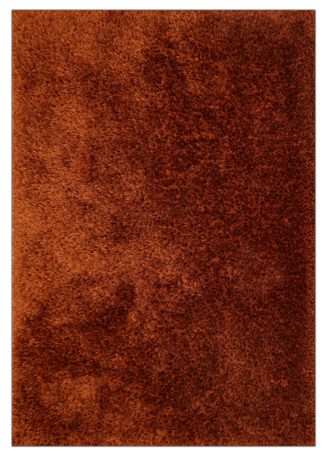 A close-up of a shaggy, textured brown rug with a warm rust-orange tone.