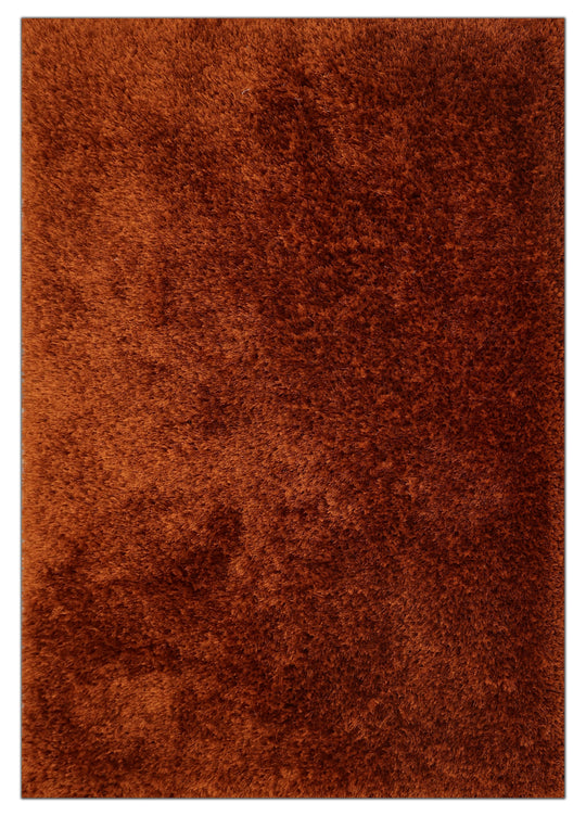 A close-up of a shaggy, textured brown rug with a warm rust-orange tone.