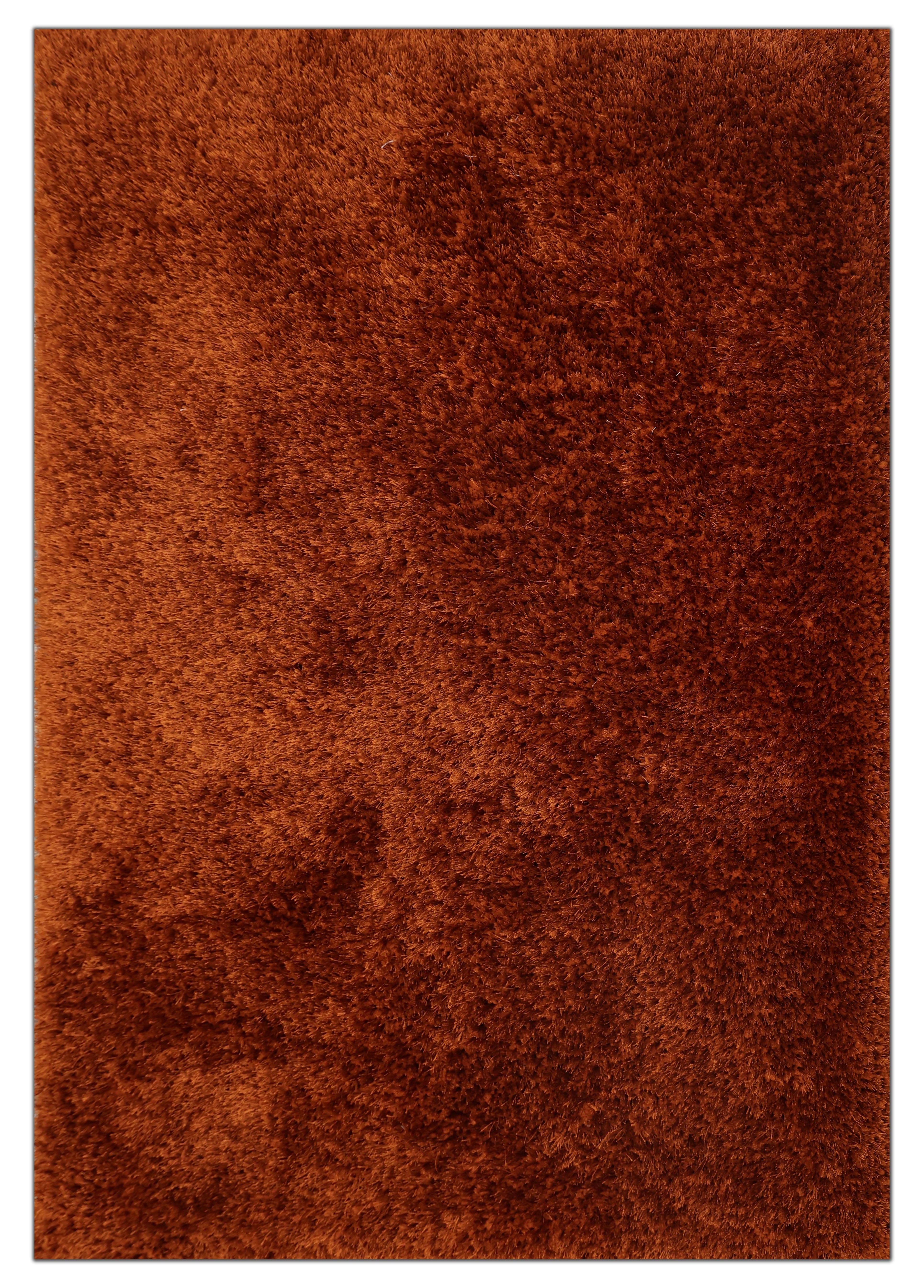 A close-up of a shaggy, textured brown rug with a warm rust-orange tone.