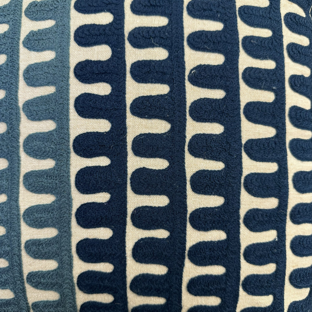 Textile with blue and beige wavy pattern