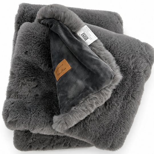 Smokey Gray fluffy blanket with brand labels on a white background