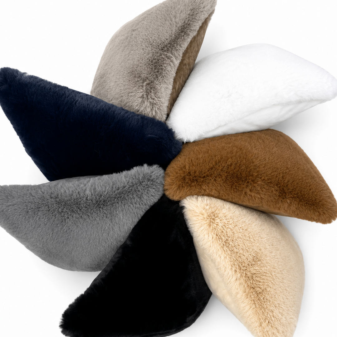 Set of six plush cushions in various colors on a white background