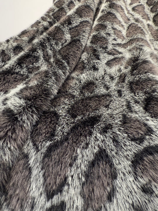 Close-up of a fur texture with a pattern resembling a giraffe's coat.